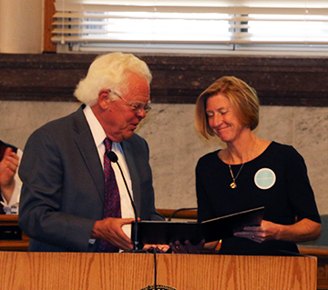 HCJFS Director  Moira Weir receives a proclamation from Vice Mayor David Mann during the Big Day of Foster Care. 